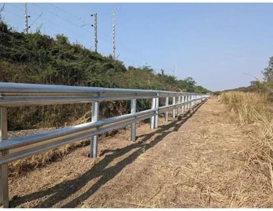 W-beam guardrail with galvanized posts on a rural highway
