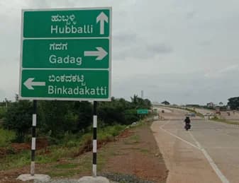 Highway directional signage on an overhead gantry